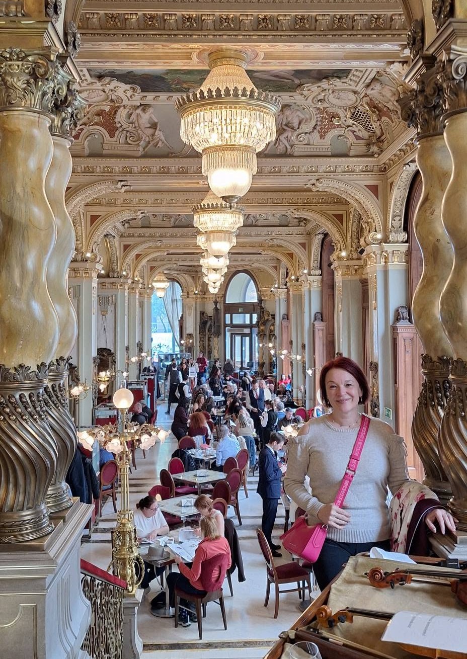 Edina inside Budapest's ornate New York Café