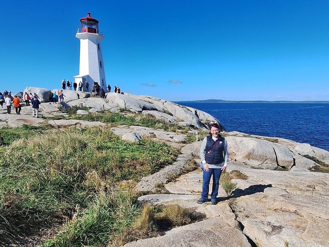Edina visiting the lighthouse at Peggy's Cove in Nova Scotia